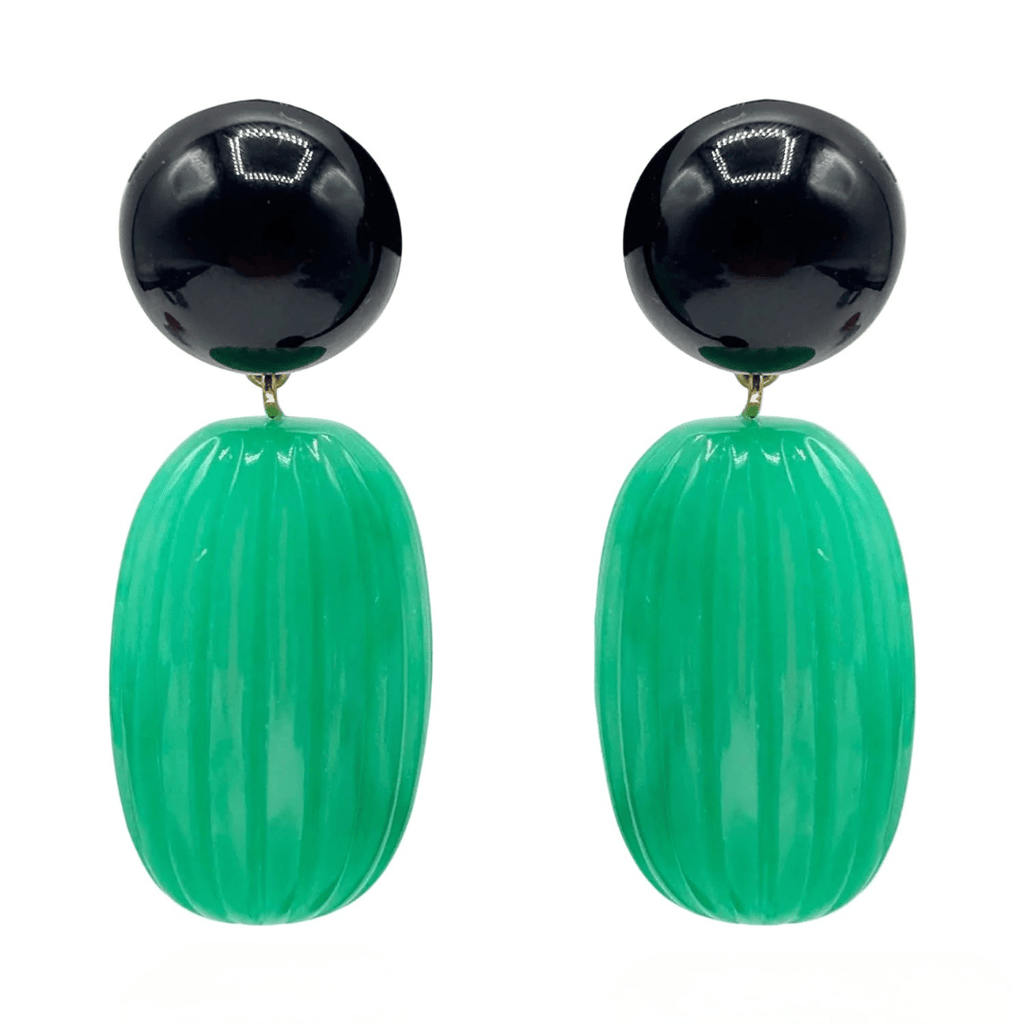 Pair of earrings with black and green beads on a white background