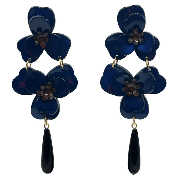 Pair of blue flower-shaped earrings with black teardrop pendants on a white background