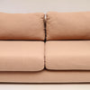 Image features the cushions of a brown mid-century modern wool sofa with a wooden frame against a white background.
