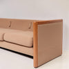 Image features the side of a brown mid-century modern wool sofa with a wooden frame against a white background.