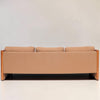 Image features the back of a brown mid-century modern wool sofa with a wooden frame against a white background.