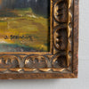Close-up of a painting with a decorative gold frame and signature on a light gray background