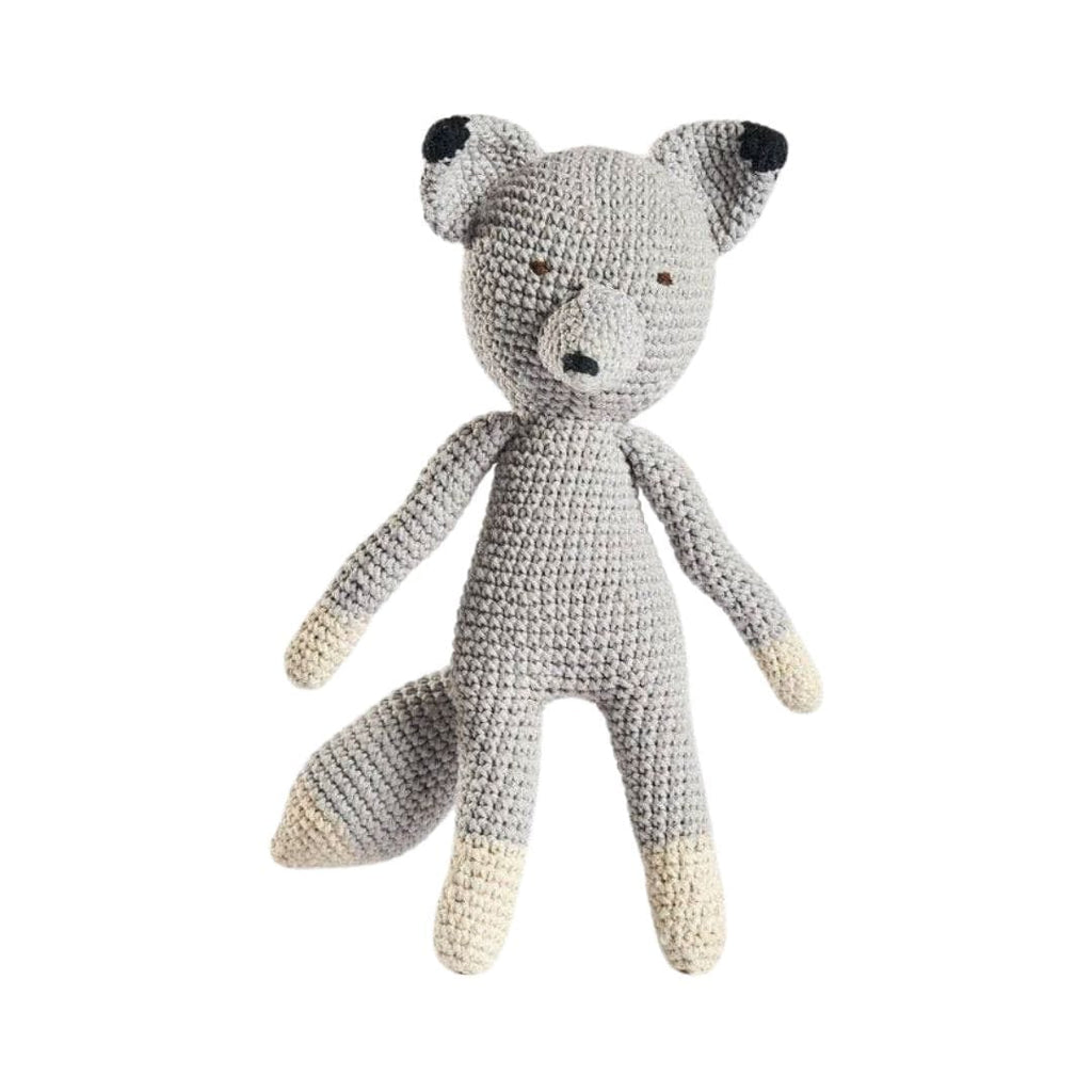 Crocheted fox toy on a white background