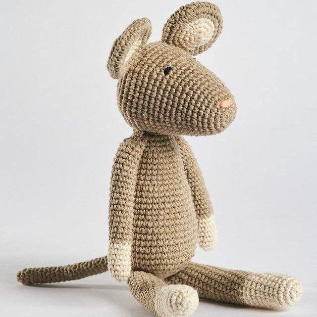 Crocheted mouse toy on a light background