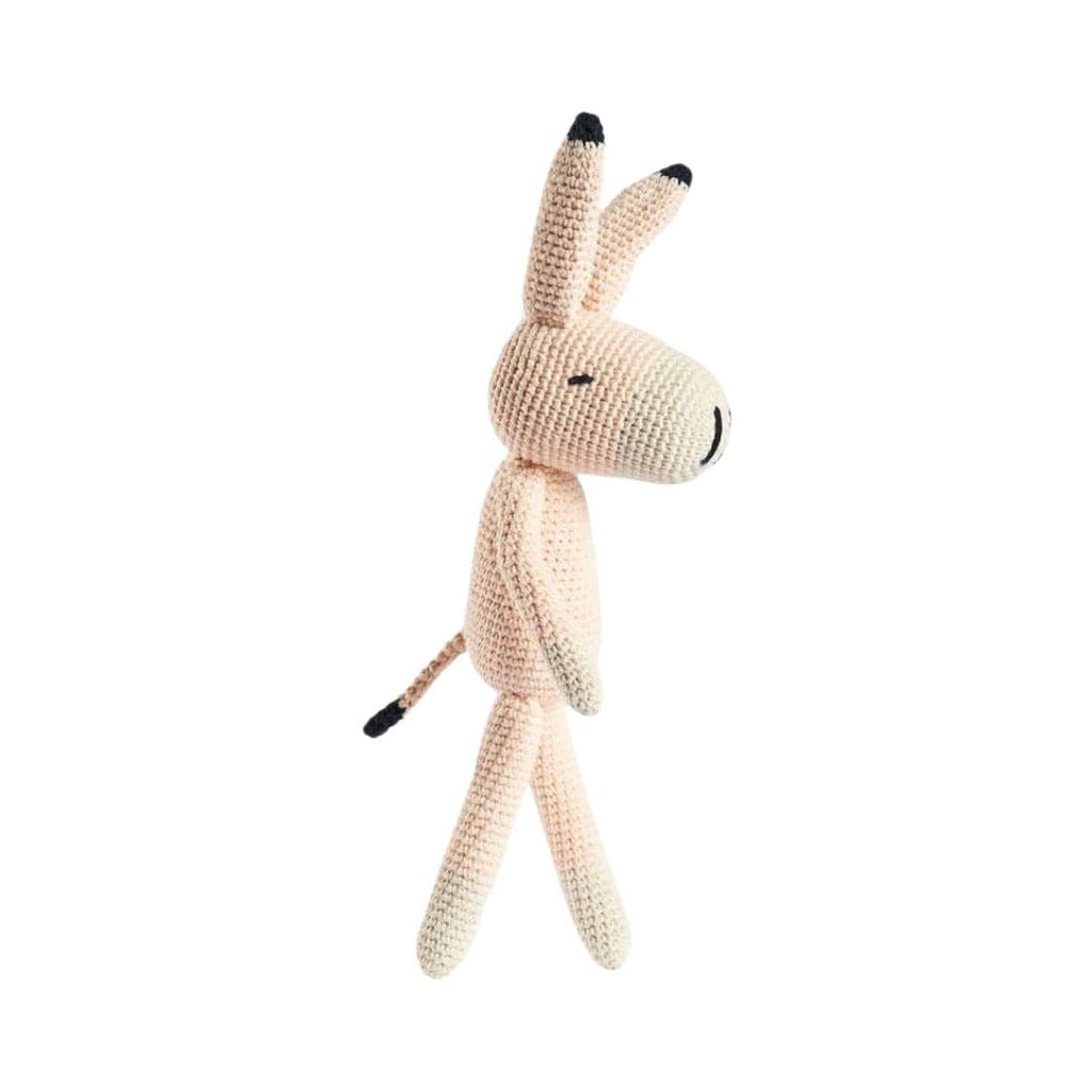 Knitted donkey toy on a white background