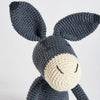 Crocheted donkey toy on a white background
