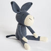 Crocheted donkey toy on a light gray background