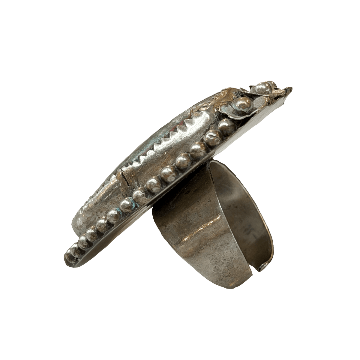 Silver ring with bead detailing on a white background