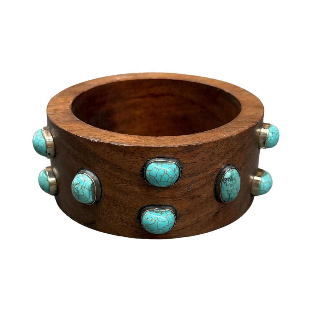 Wooden bracelet with turquoise stones on a white background
