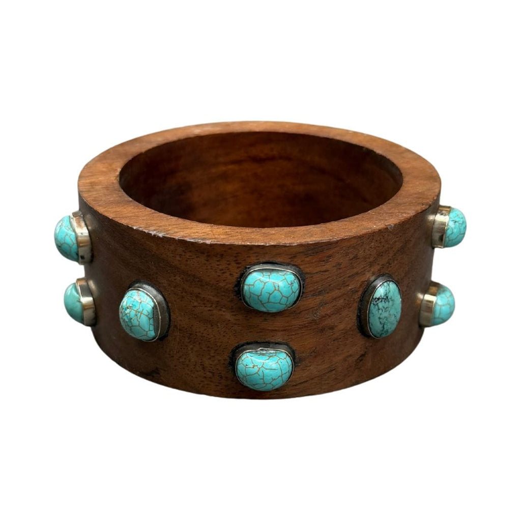 Wooden bracelet with turquoise stones on a white background