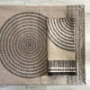 Decorative napkin with geometric pattern on a wooden floor