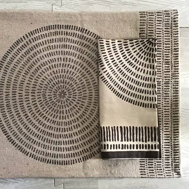 Decorative napkin with geometric pattern on a wooden floor