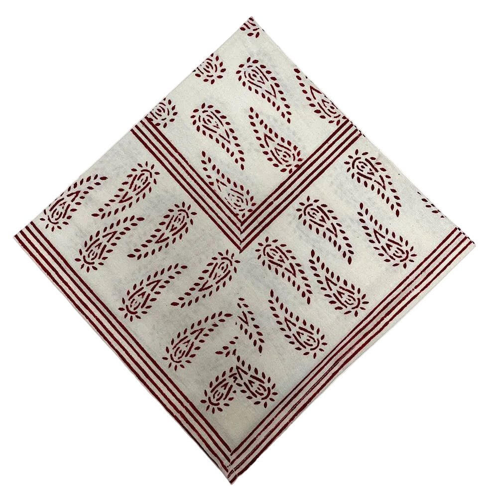 Beige napkin with red pattern on a white background