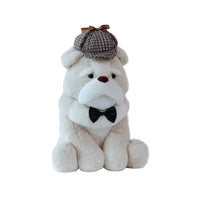 Plush toy bulldog wearing a bow tie and checkered hat on a white background