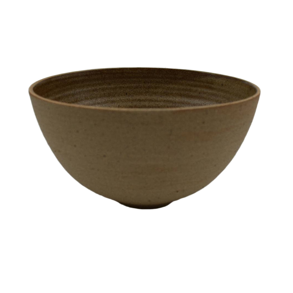 Brown ceramic bowl on a light gray background