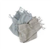 Two striped towels, one gray and one blue, on a white background