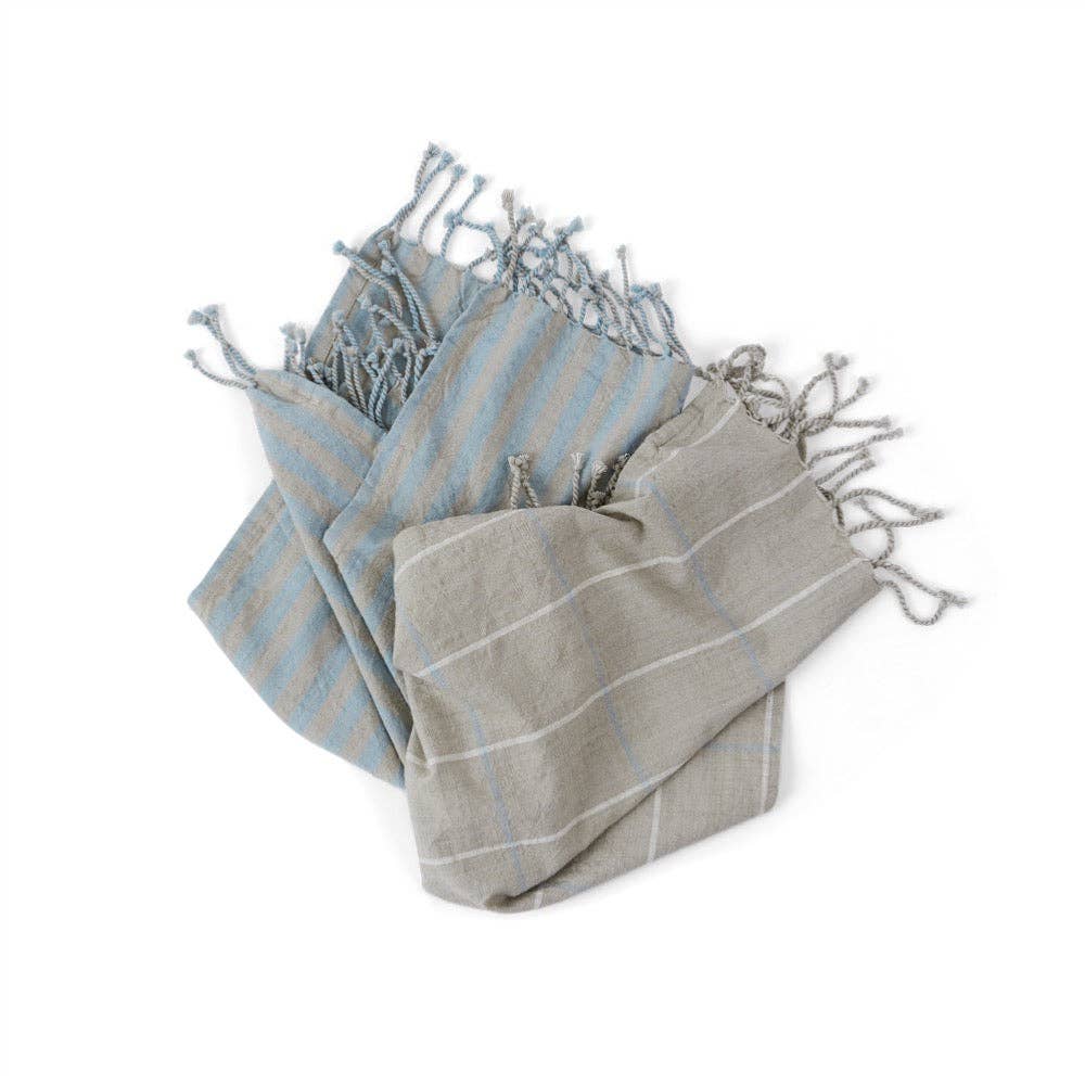 Two striped towels, one gray and one blue, on a white background
