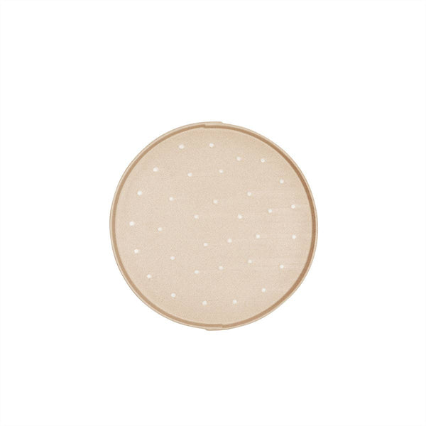 tan and white round tray on a white background