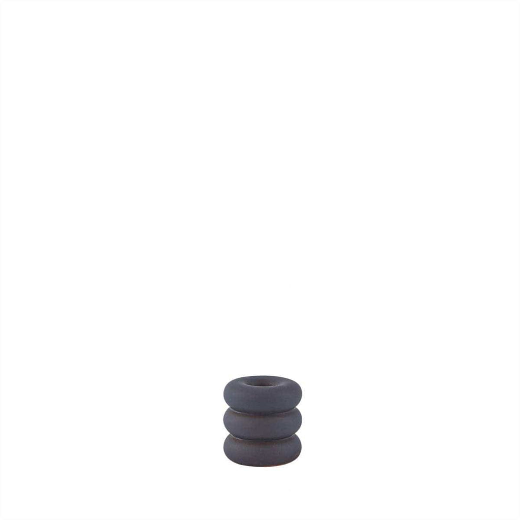 blue ceramic rounded candle holder on white background