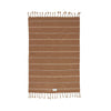 Brown striped towel with tassels on a white background