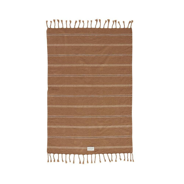 Brown striped towel with tassels on a white background