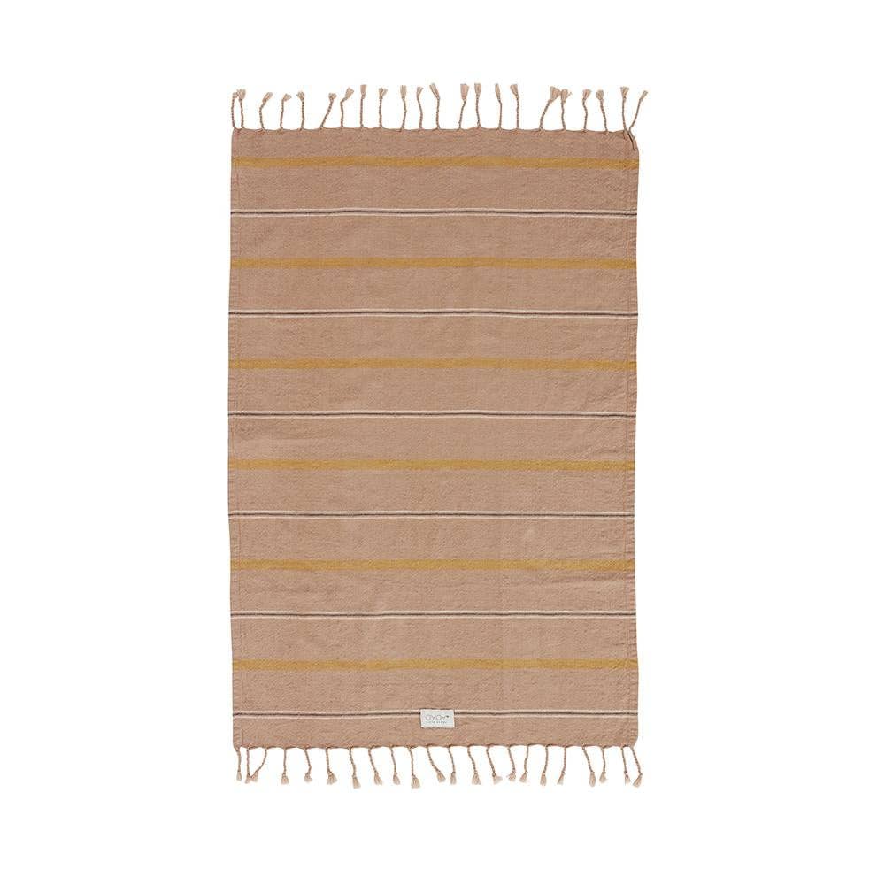 Beige and yellow striped towel with tassels on a white background