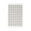 Plaid towel with fringe on a white background