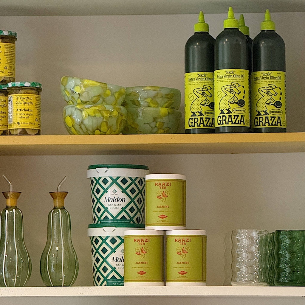 Shelves with various products including bottles and containers on a neutral background