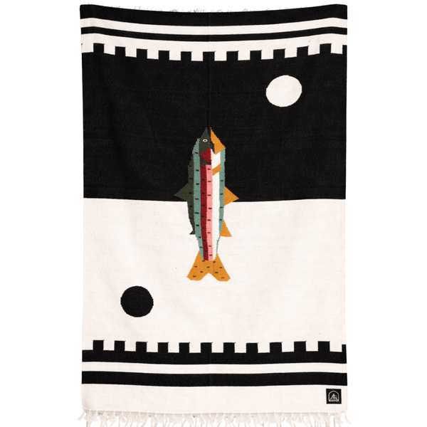blanket with a fish design on a black and white background