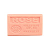 Pink bar of soap with 'ROSE' and branding on a white background