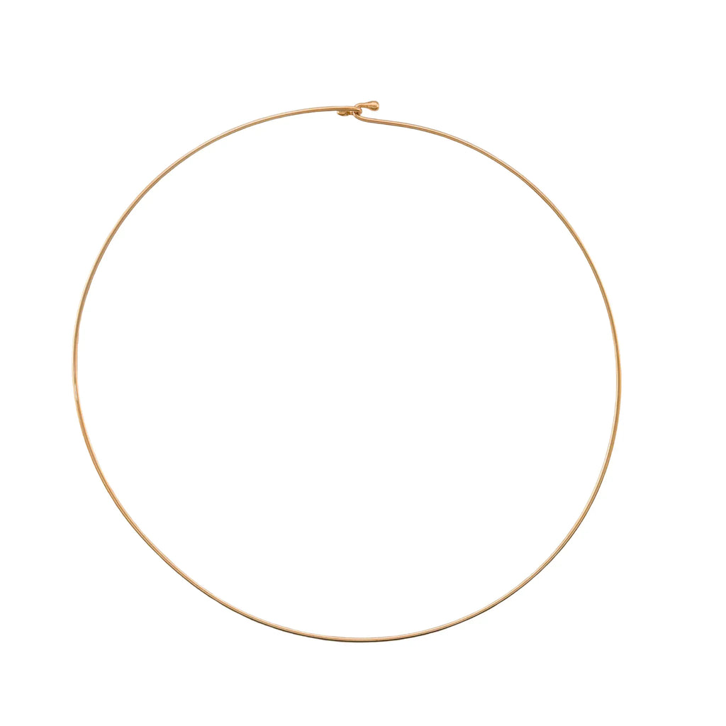 Gold plated wire choker necklace on a white background