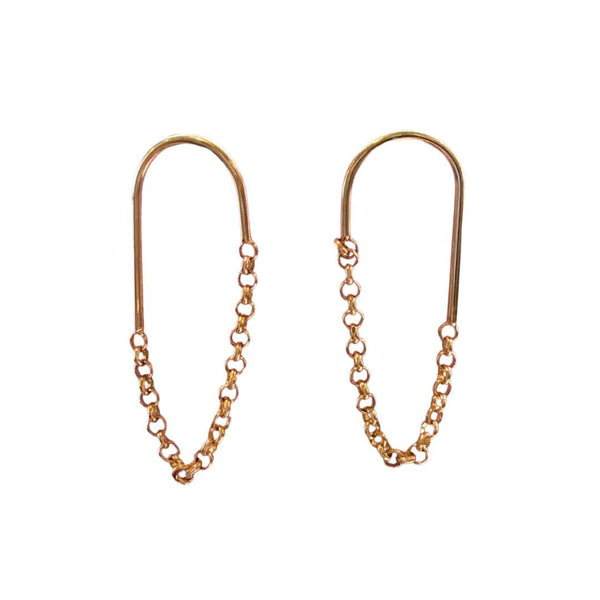 Gold chain earrings on a white background