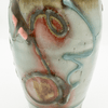 Glass vase with multicolored design on a white background
