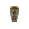 Ceramic vase with artistic design on a white background