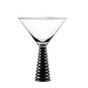 Cocktail glass with black ribbed stem on a white background
