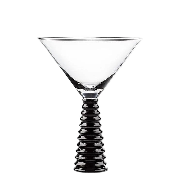 Cocktail glass with black ribbed stem on a white background