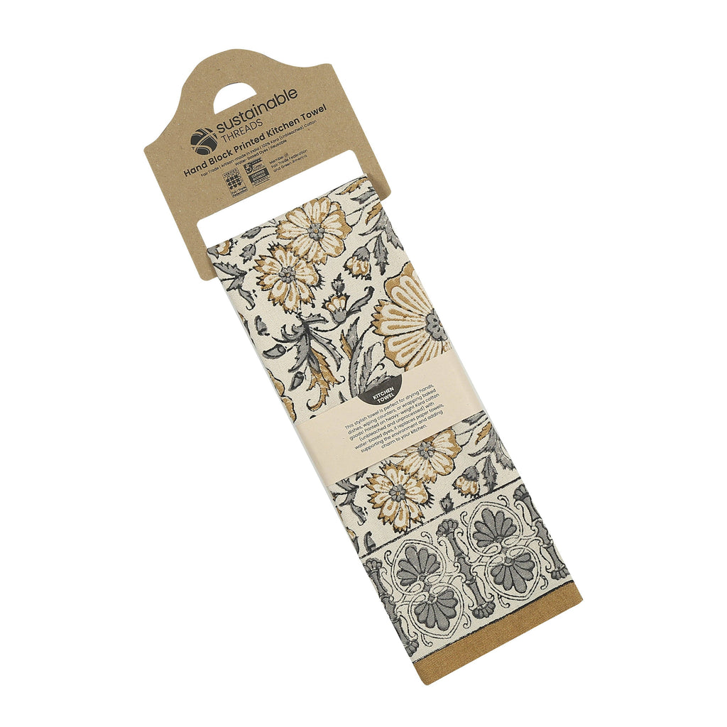 Packaged kitchen towel with floral pattern on a white background