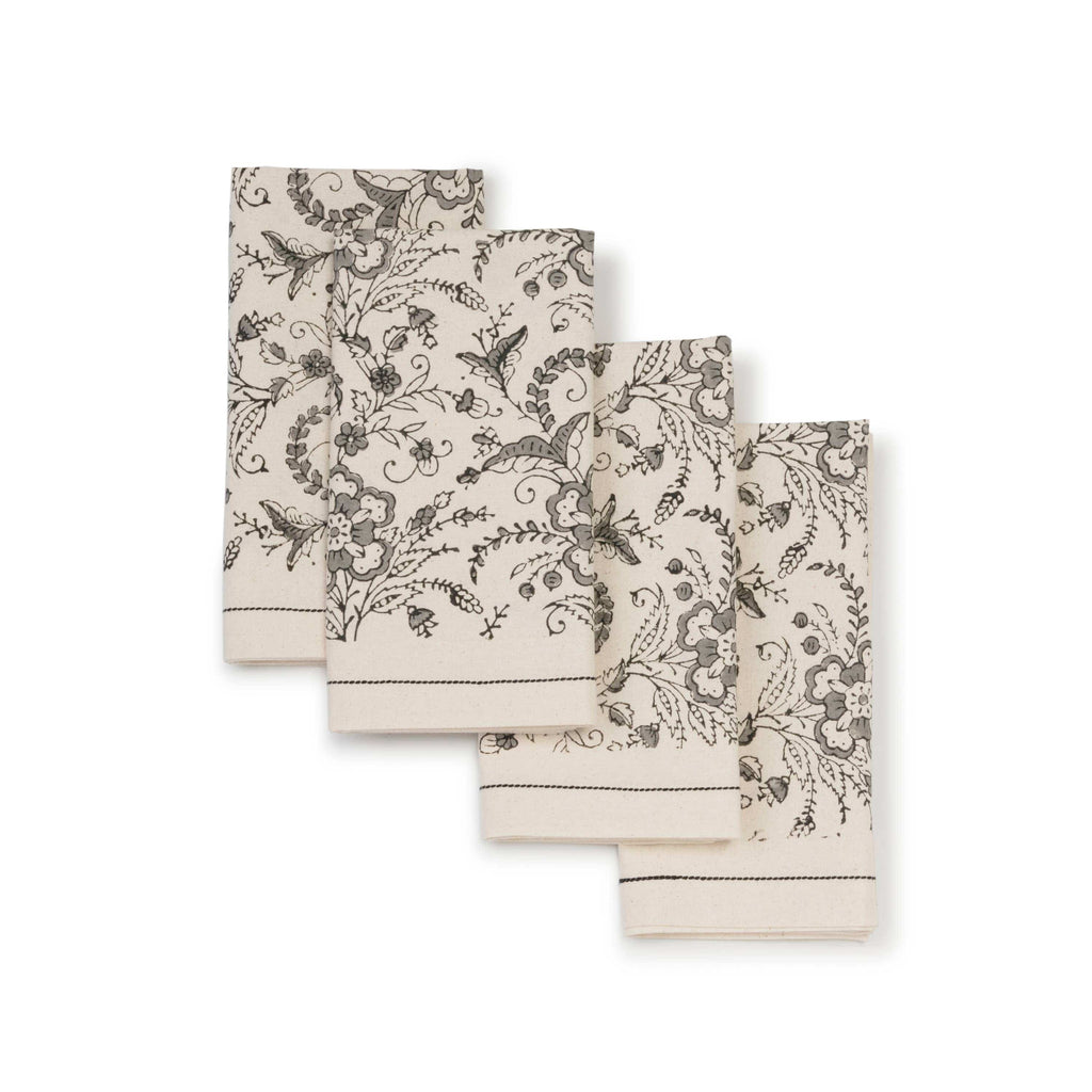 Set of three patterned towels on a white background