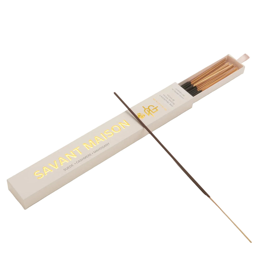 Incense sticks with a branded box on a light beige background