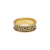Gold ring with black geometric pattern on a white background