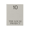 Book titled 'The Local Project' with number 10 on a light gray cover