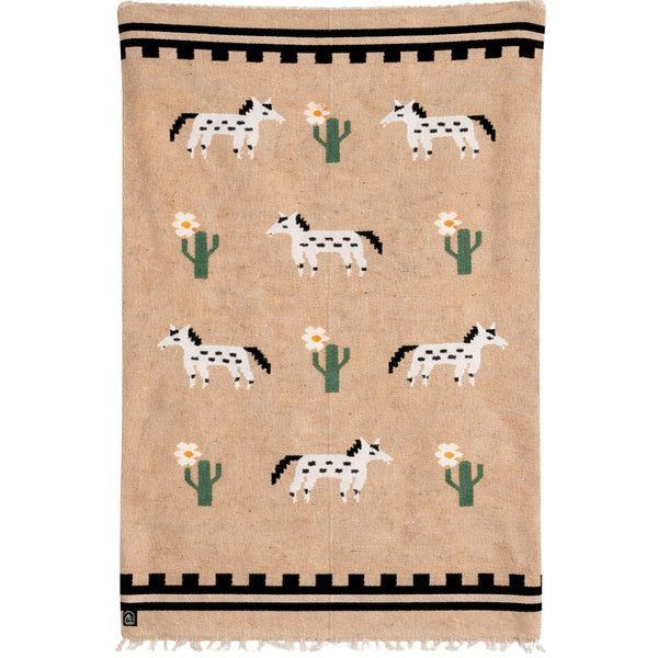 Beige rug with horse and cactus pattern on a white background