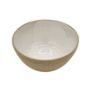Ceramic bowl with a textured exterior on a white background