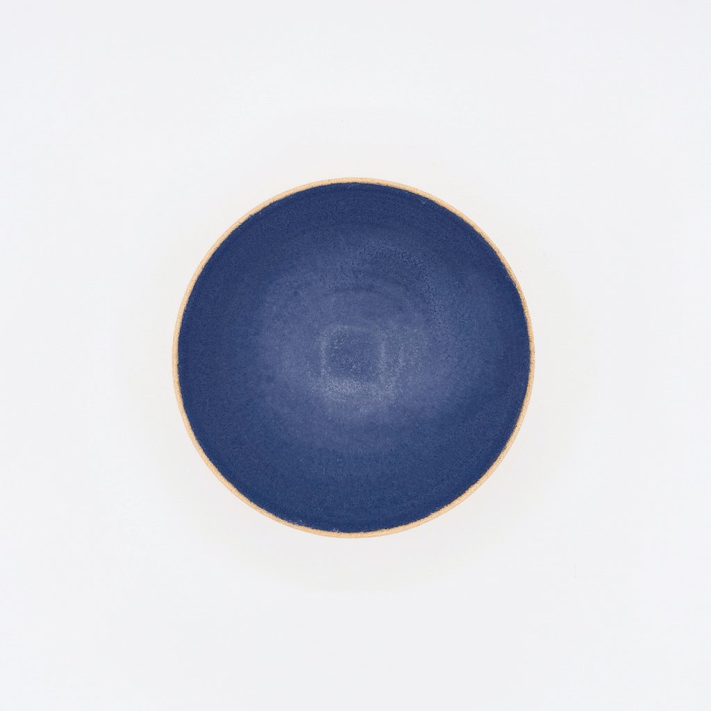 Blue ceramic bowl on a white background