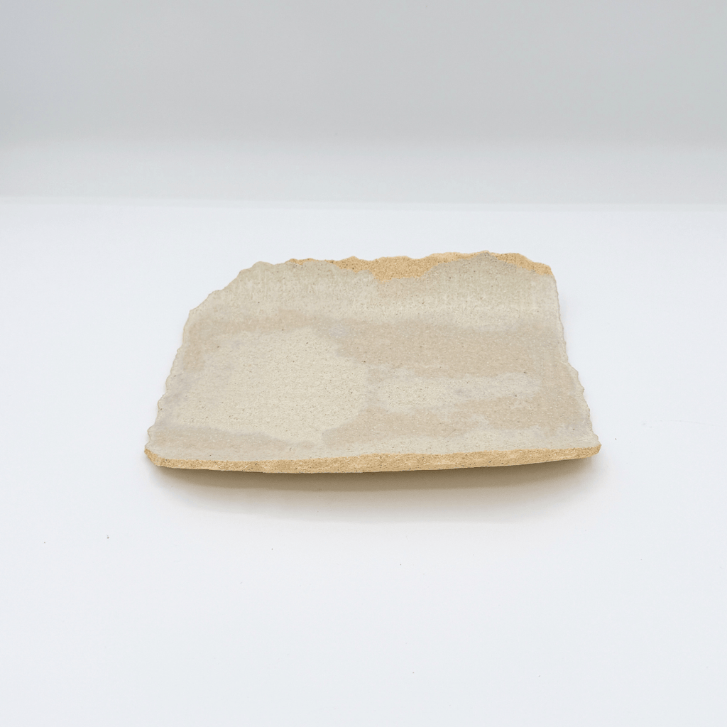 Rectangular piece of stone or ceramic on a white background