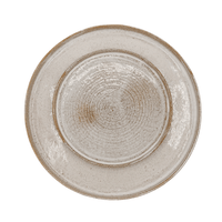 Round ceramic plate with textured surface on a white background