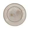 Round ceramic plate with textured surface on a white background