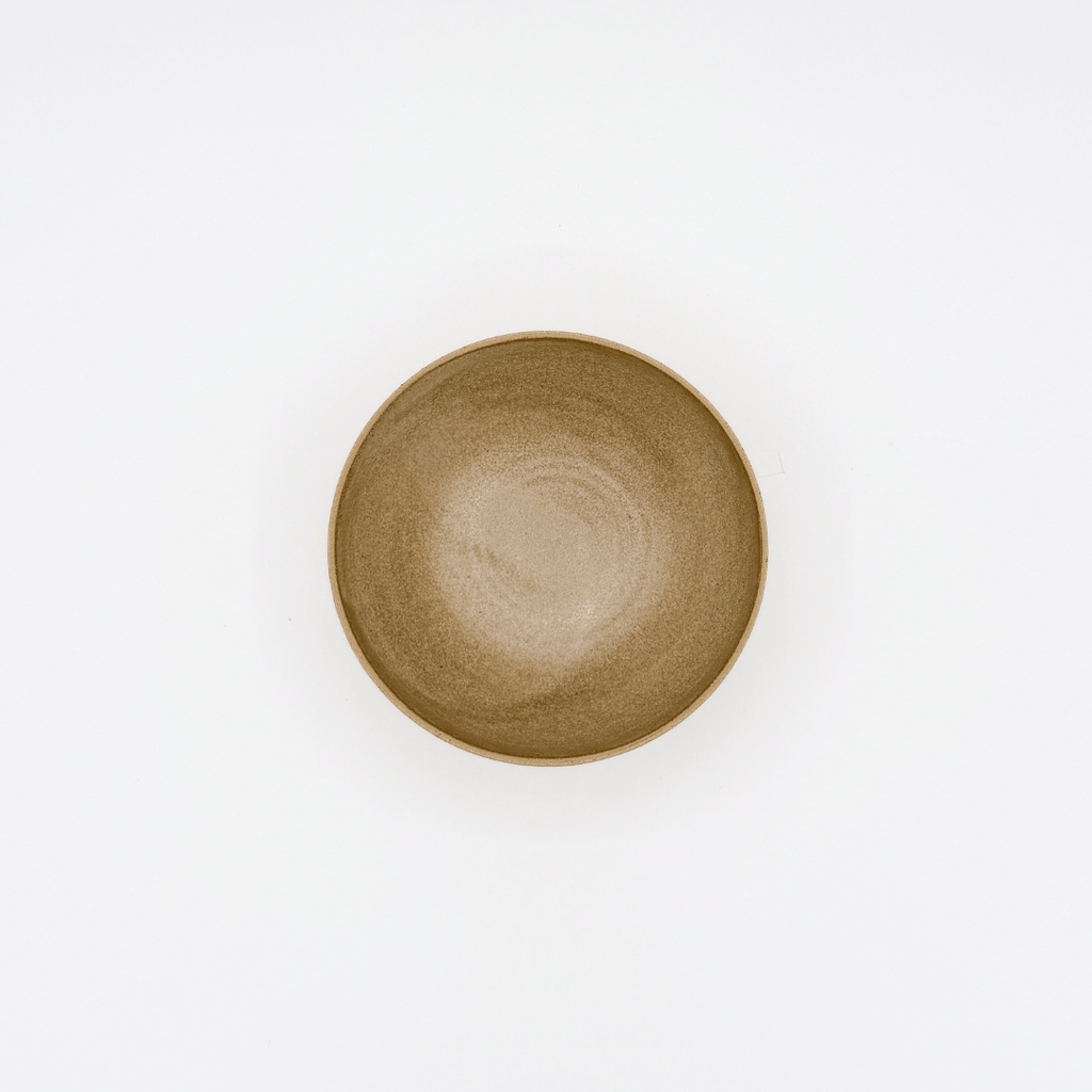 Brown ceramic bowl on a white background