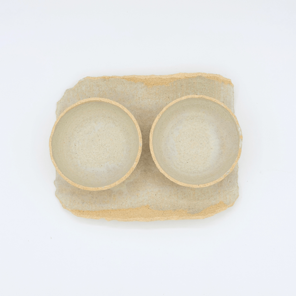 ceramic serving set with two cups on white background modern nomad home