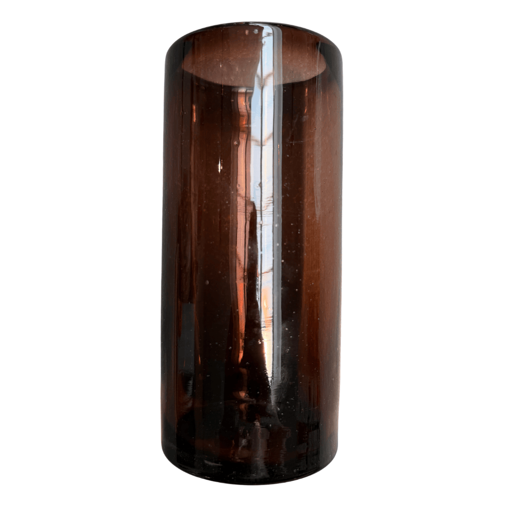 Brown cylindrical glass vase on a white background